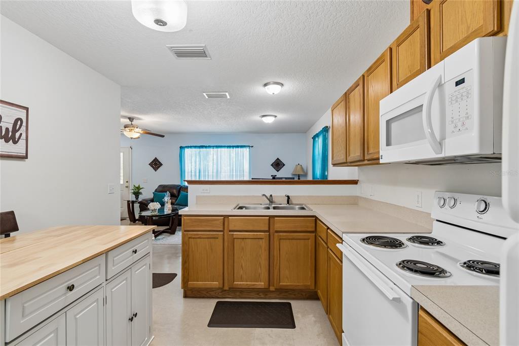468 North Wheeler Avenue Inverness, FL 34453 - Photo 10 of 24 a kitchen that has a sink and a stove