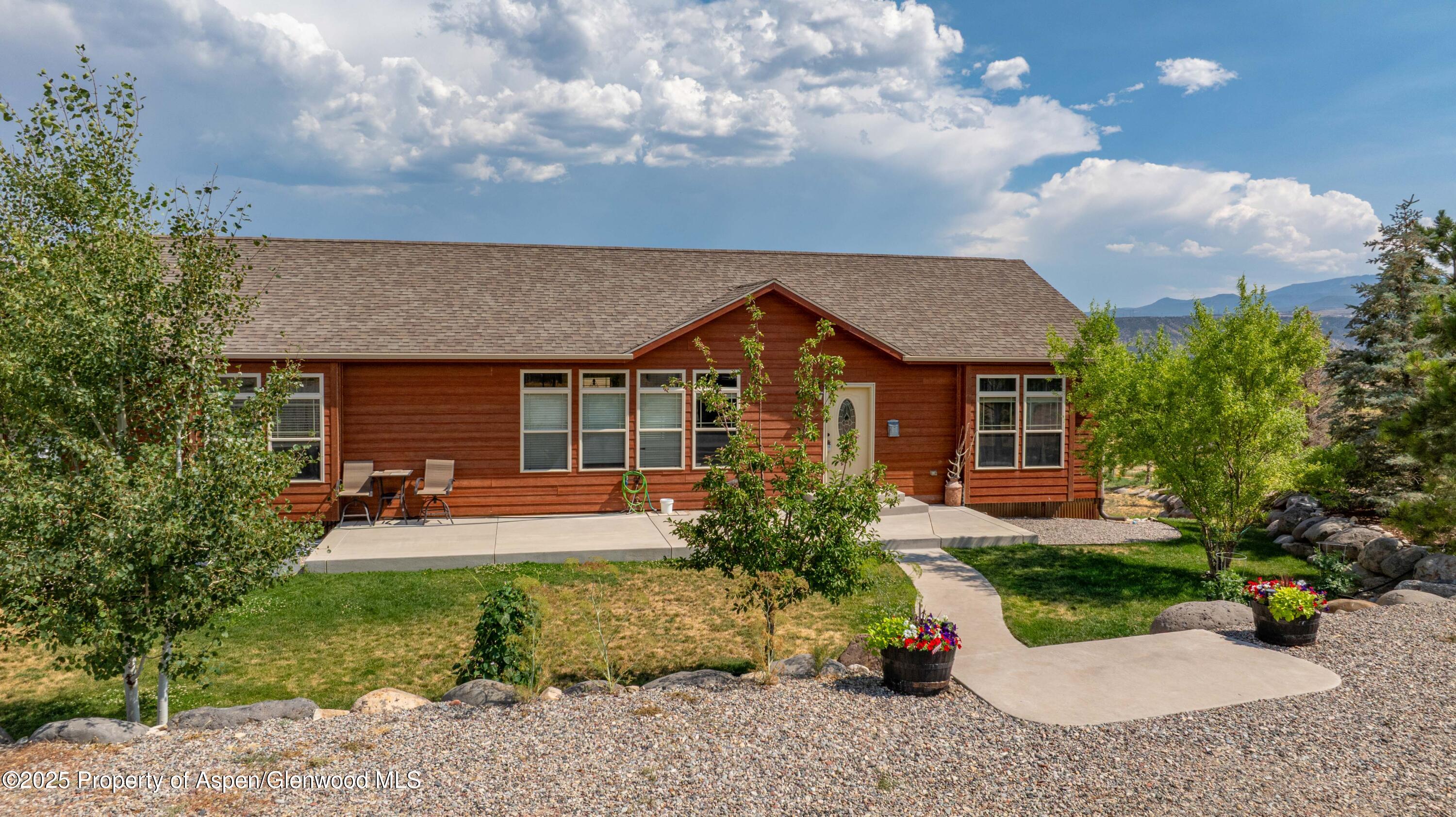 front view of a house with a yard