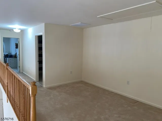 a view of hallway with livingroom