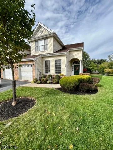 a house view with a garden space