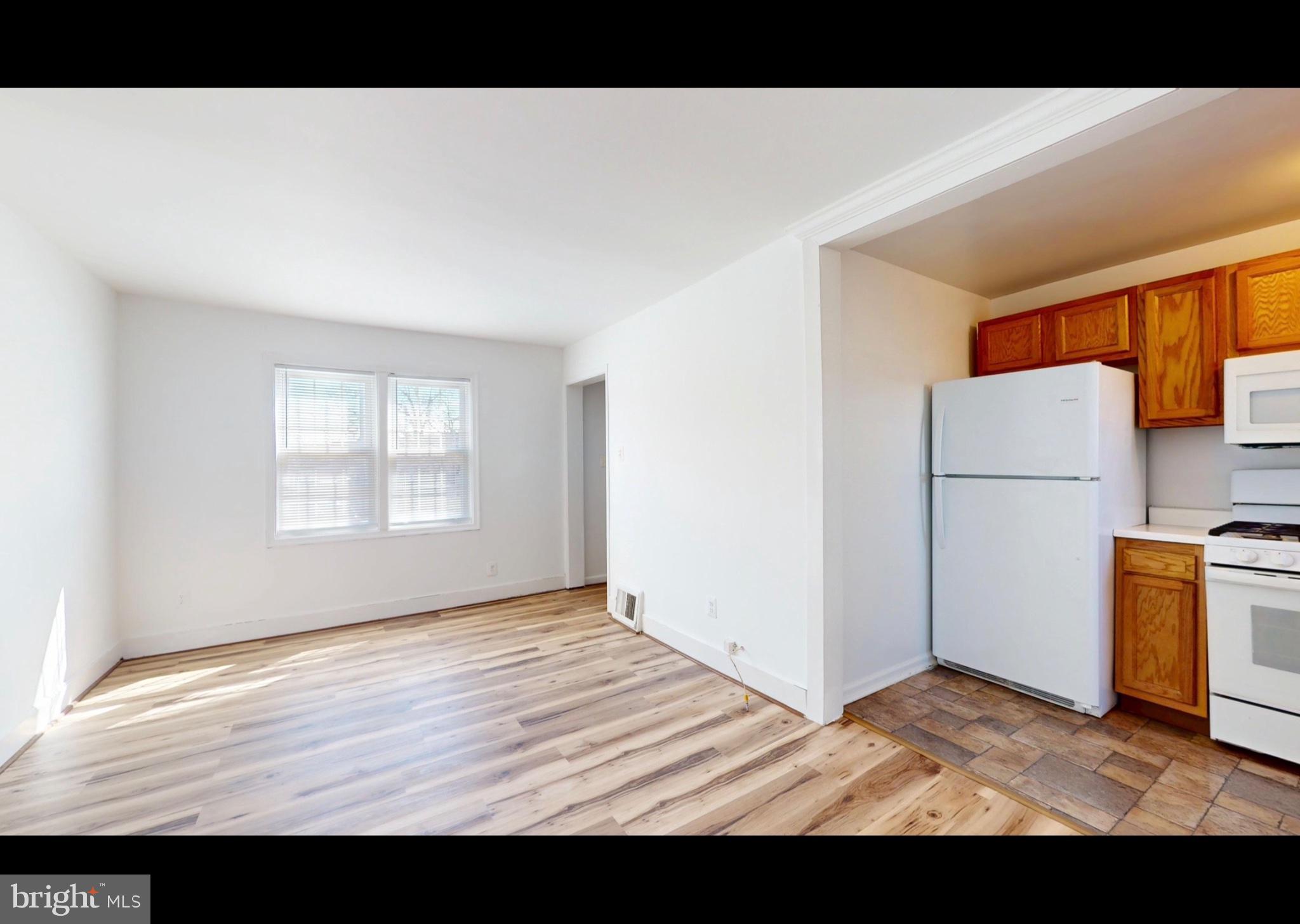 944 1st Street Brooklyn, MD 21225 - Photo 4 of 17 Bright and airy open living space.