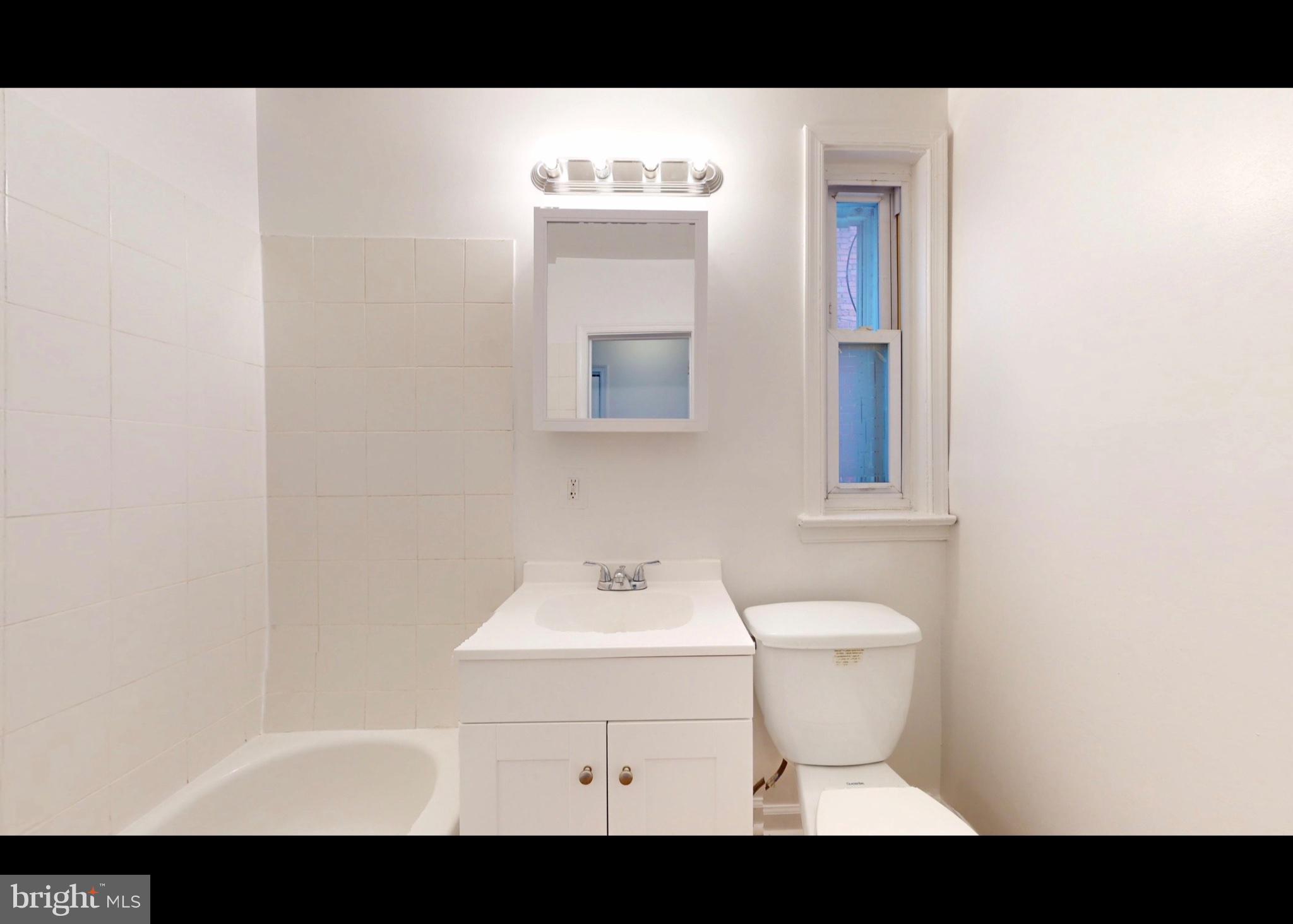 944 1st Street Brooklyn, MD 21225 - Photo 6 of 17 Bright and airy bathroom retreat.
