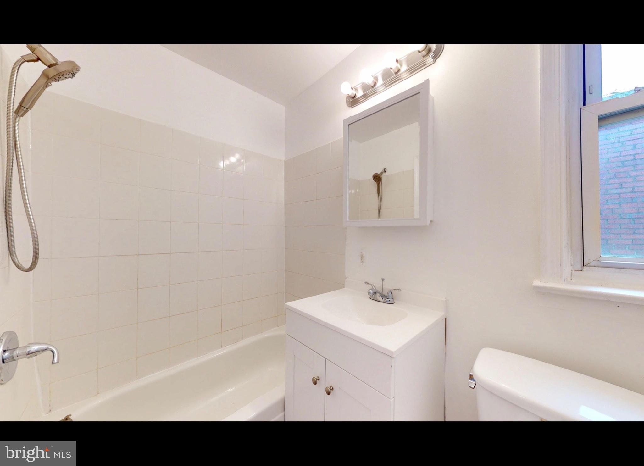 944 1st Street Brooklyn, MD 21225 - Photo 10 of 17 Bright and airy bathroom retreat.