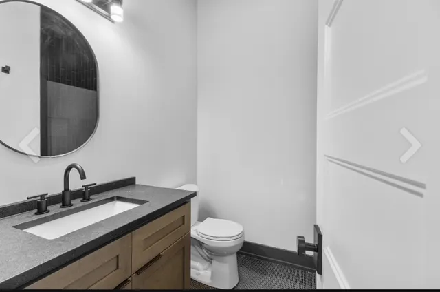 a view of a room with wooden floor and a window