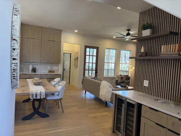 a view of kitchen and dining room with wooden floor