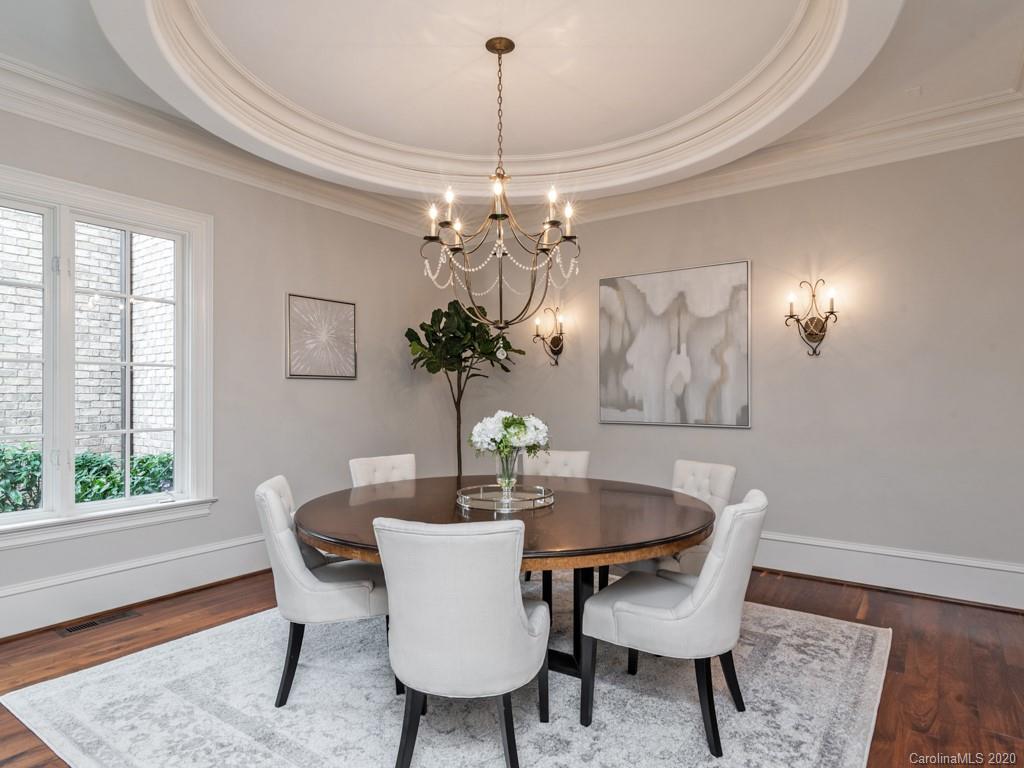 404 Eagle Bend Drive Waxhaw, NC 28173 - Photo 15 of 46 a dining room with furniture a rug and a chandelier