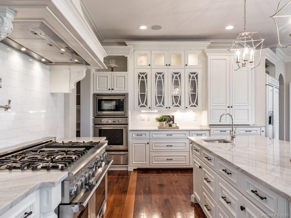 404 Eagle Bend Drive Waxhaw, NC 28173 - Photo 16 of 46 a kitchen with stainless steel appliances granite countertop a stove and a sink