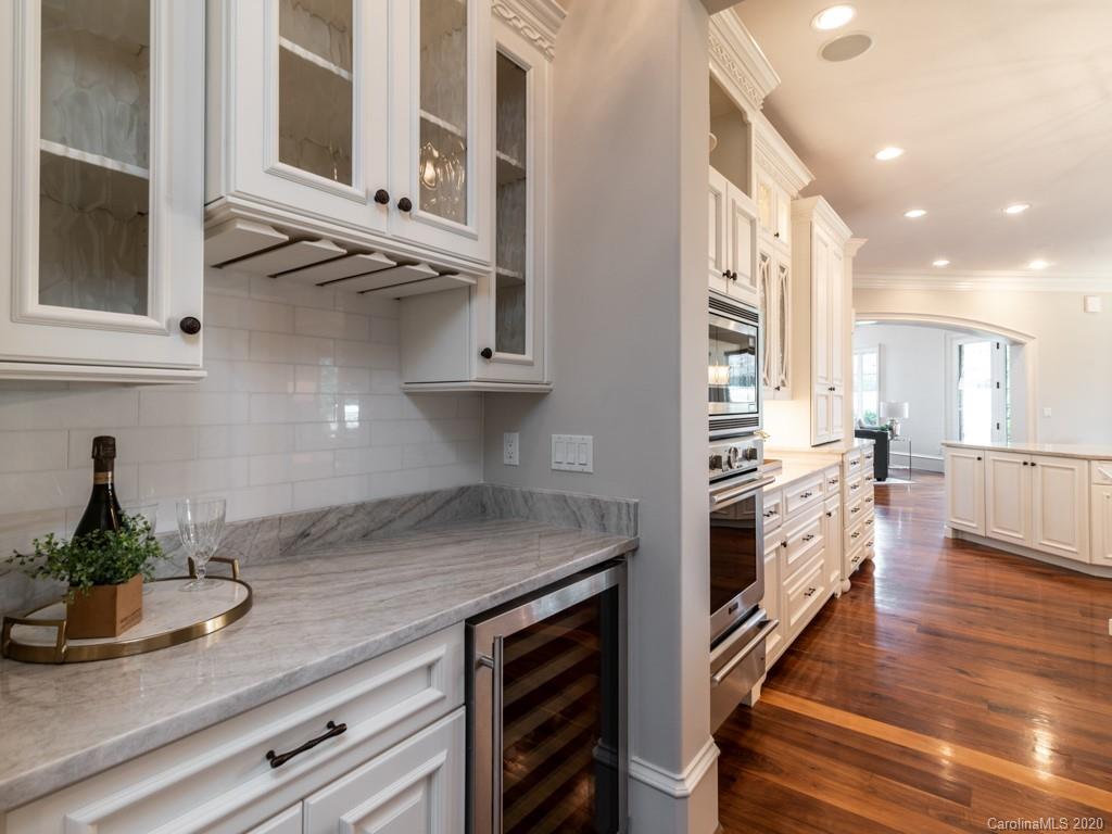404 Eagle Bend Drive Waxhaw, NC 28173 - Photo 19 of 46 a kitchen with white cabinets and appliances