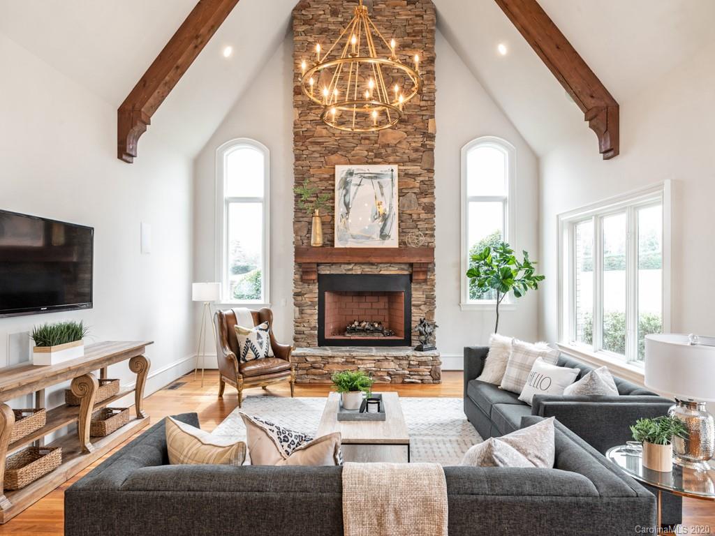 404 Eagle Bend Drive Waxhaw, NC 28173 - Photo 24 of 46 a living room with furniture a fireplace and a flat screen tv