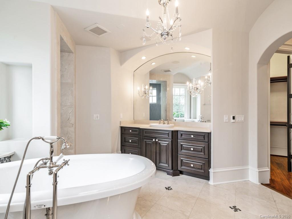 404 Eagle Bend Drive Waxhaw, NC 28173 - Photo 30 of 46 a spacious bathroom with a double vanity sink and a mirror
