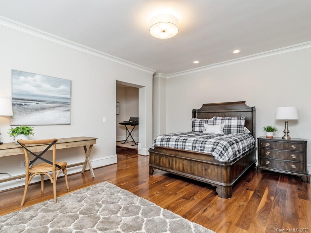 404 Eagle Bend Drive Waxhaw, NC 28173 - Photo 37 of 46 a bedroom with a bed and chair