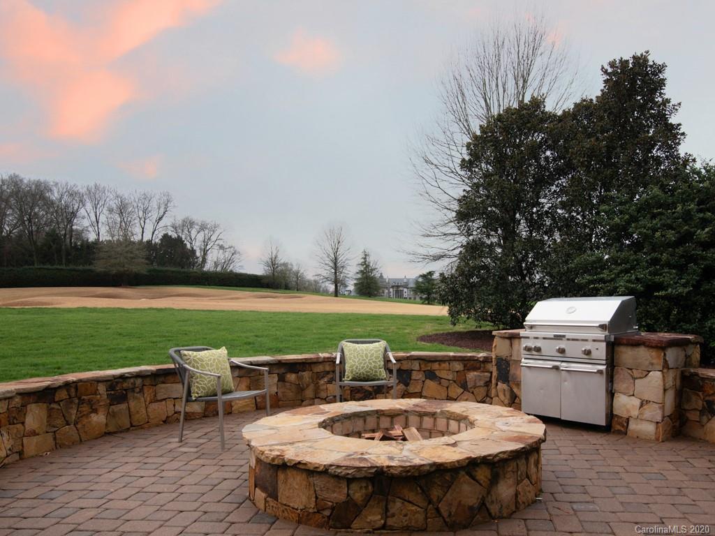 404 Eagle Bend Drive Waxhaw, NC 28173 - Photo 45 of 46 a view of a swimming pool and lounge chairs in back of a house
