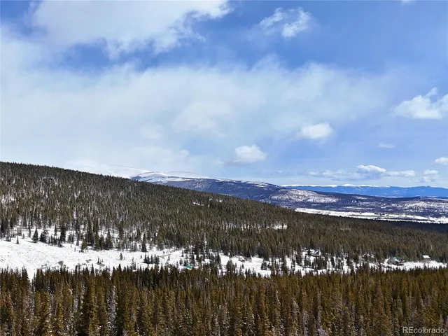 a view of a backyard of a house with a street