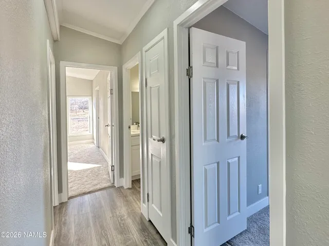 a view of a bathroom from the hallway