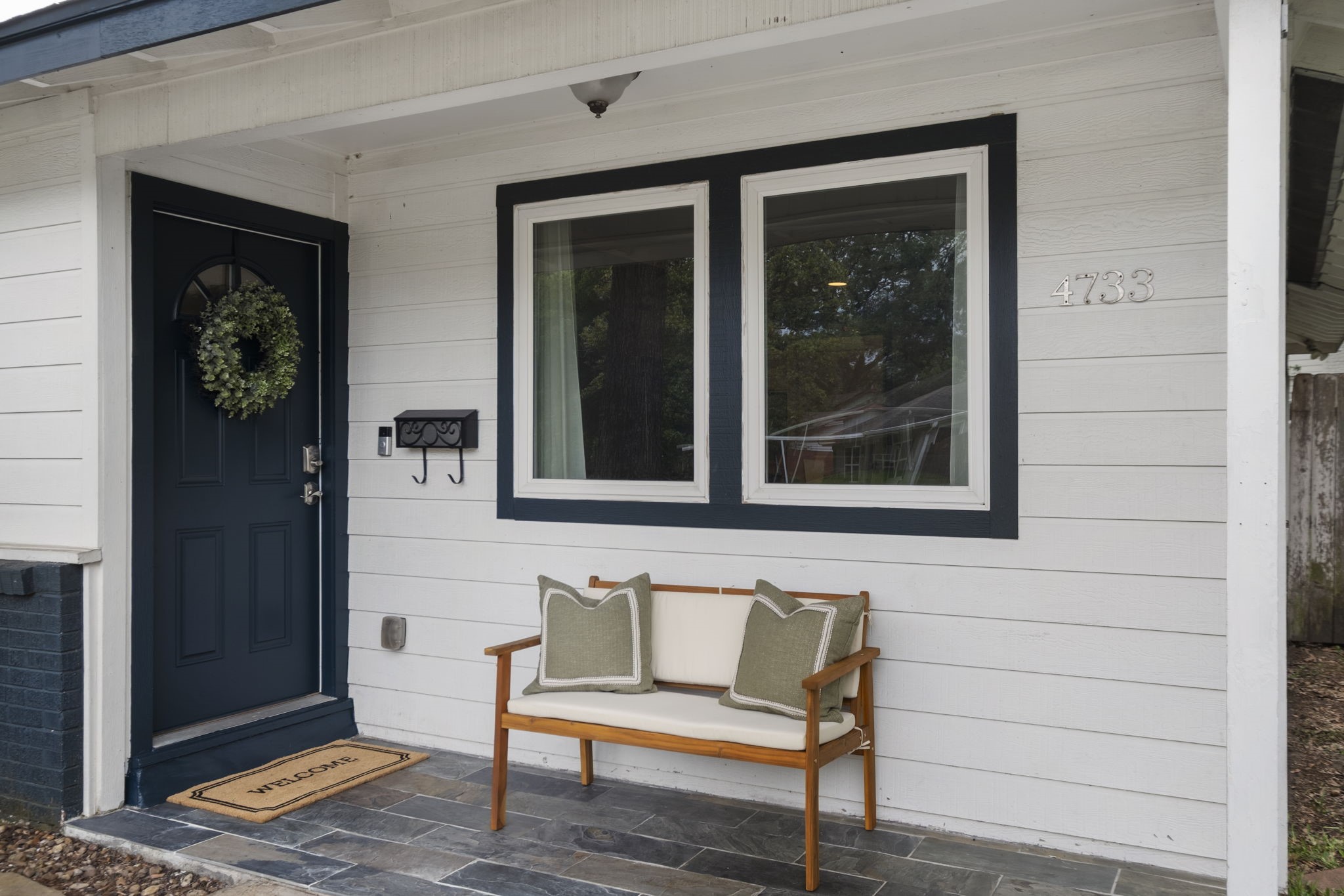4733 Carleen Road Houston, TX 77092 - Photo 3 of 22 The covered front porch creates a cozy entry with updated exterior finishes and space for morning coffee or evening conversations.
