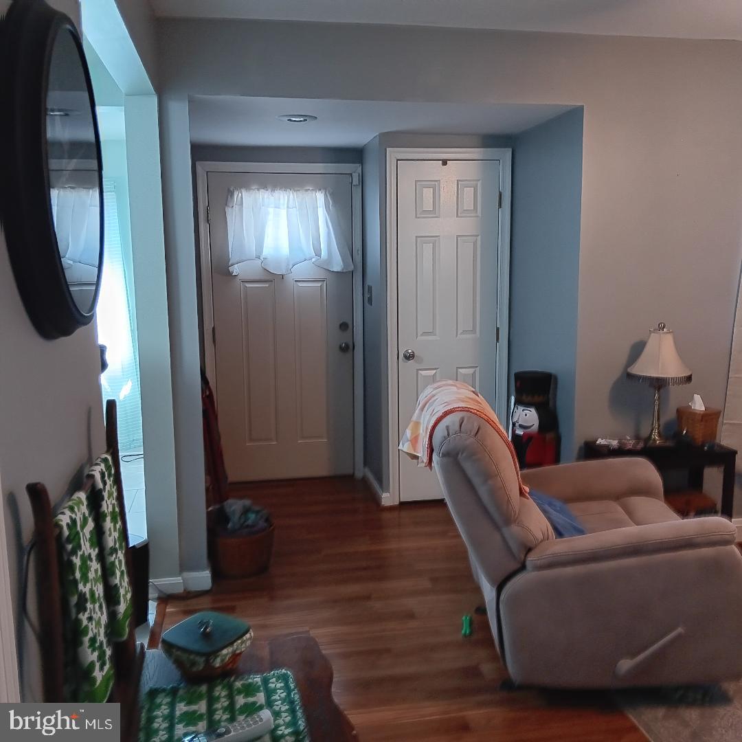 33 Left Wing Drive Baltimore, MD 21220 - Photo 11 of 17 a living room with furniture and a fireplace