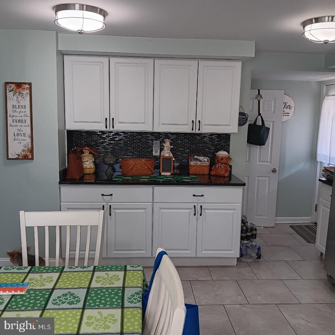 33 Left Wing Drive Baltimore, MD 21220 - Photo 12 of 17 a kitchen with a sink and cabinets