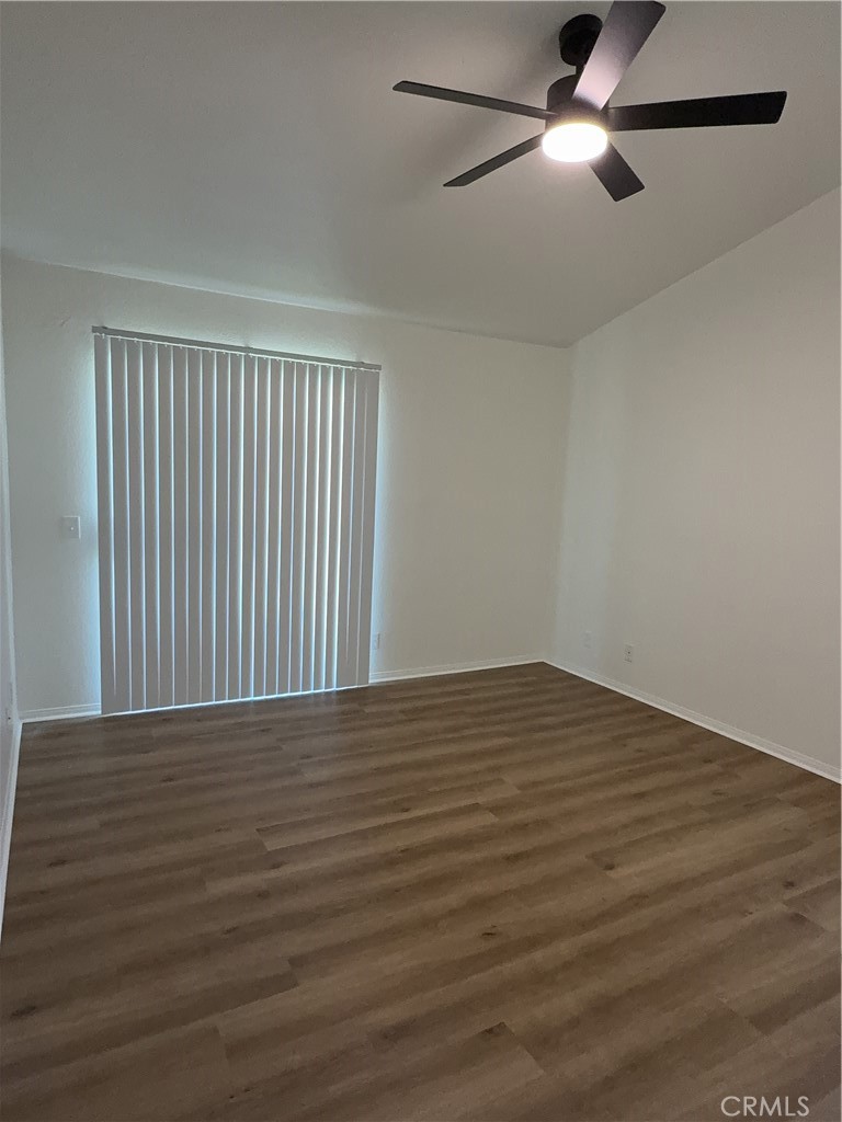 12590 Cobalt Road Victorville, CA 92392 - Photo 28 of 37 a view of an empty room with wooden floor
