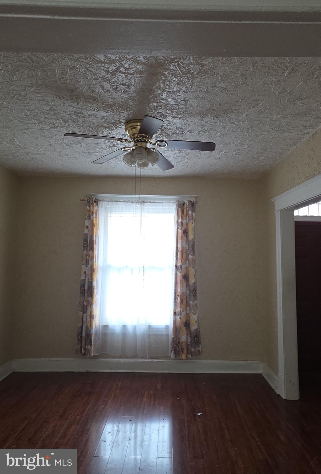 38 N Street Northwest Washington, DC 20001 - Photo 5 of 20 a view of empty room with wooden floor and fan