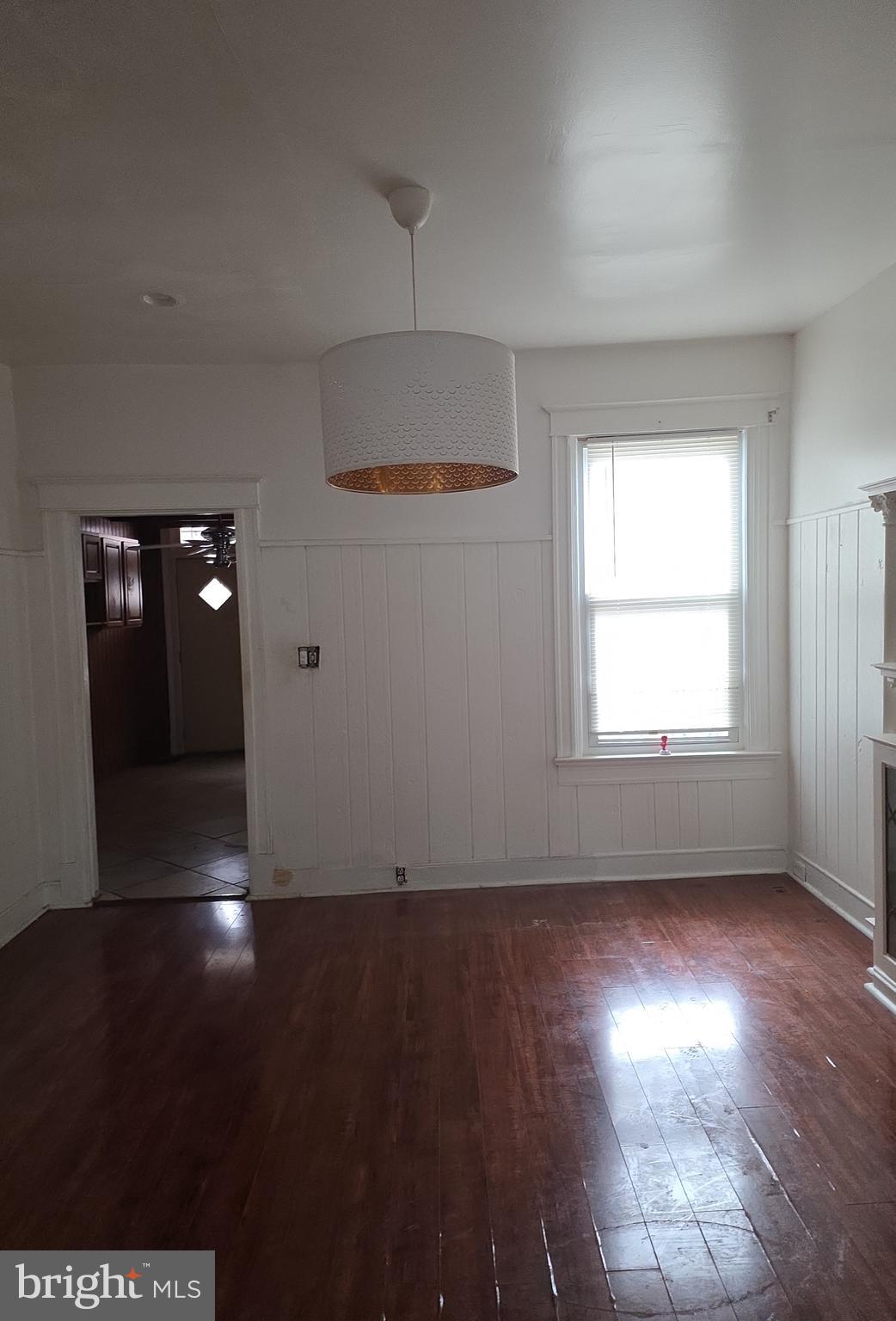 38 N Street Northwest Washington, DC 20001 - Photo 6 of 20 an empty room with wooden floor and windows
