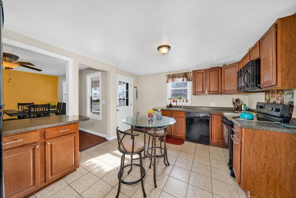 107 Apsley Street Hudson, MA 01749 - Photo 4 of 26 a kitchen with granite countertop a sink and white appliances