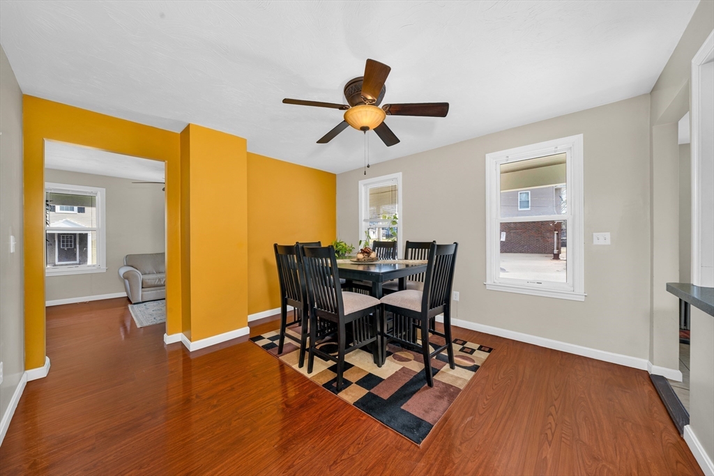 107 Apsley Street Hudson, MA 01749 - Photo 6 of 26 a view of a dining room with furniture and wooden floor