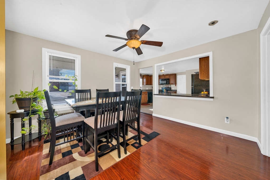 107 Apsley Street Hudson, MA 01749 - Photo 7 of 26 a view of a dining room with furniture and wooden floor