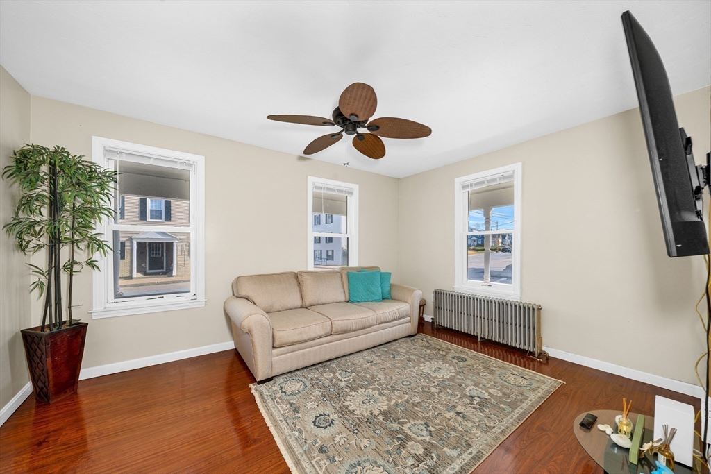107 Apsley Street Hudson, MA 01749 - Photo 8 of 26 a living room with furniture and a window