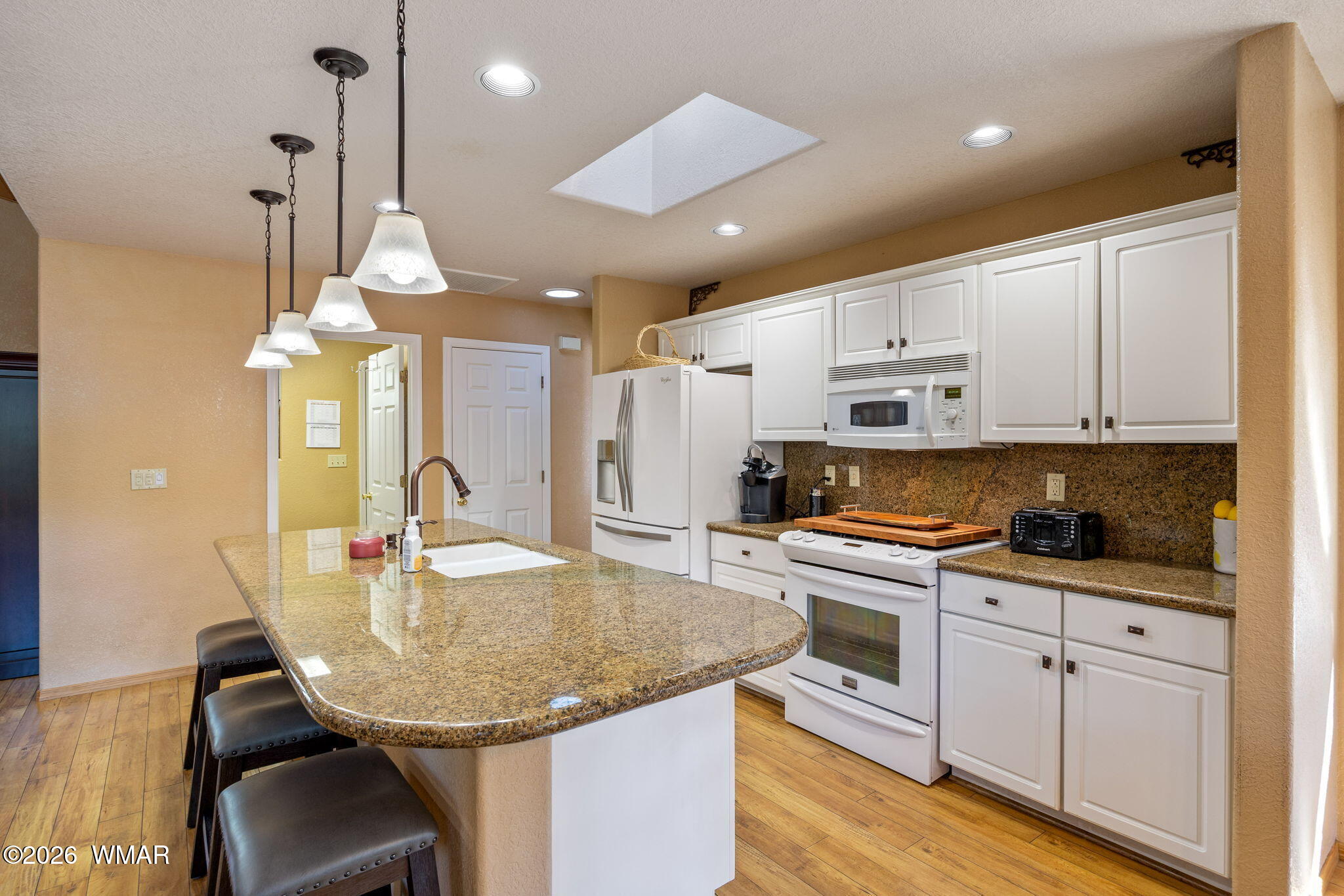 6735 Sunset Trail Pinetop, AZ 85935 - Photo 11 of 33 a kitchen with stainless steel appliances granite countertop a sink a stove and a refrigerator