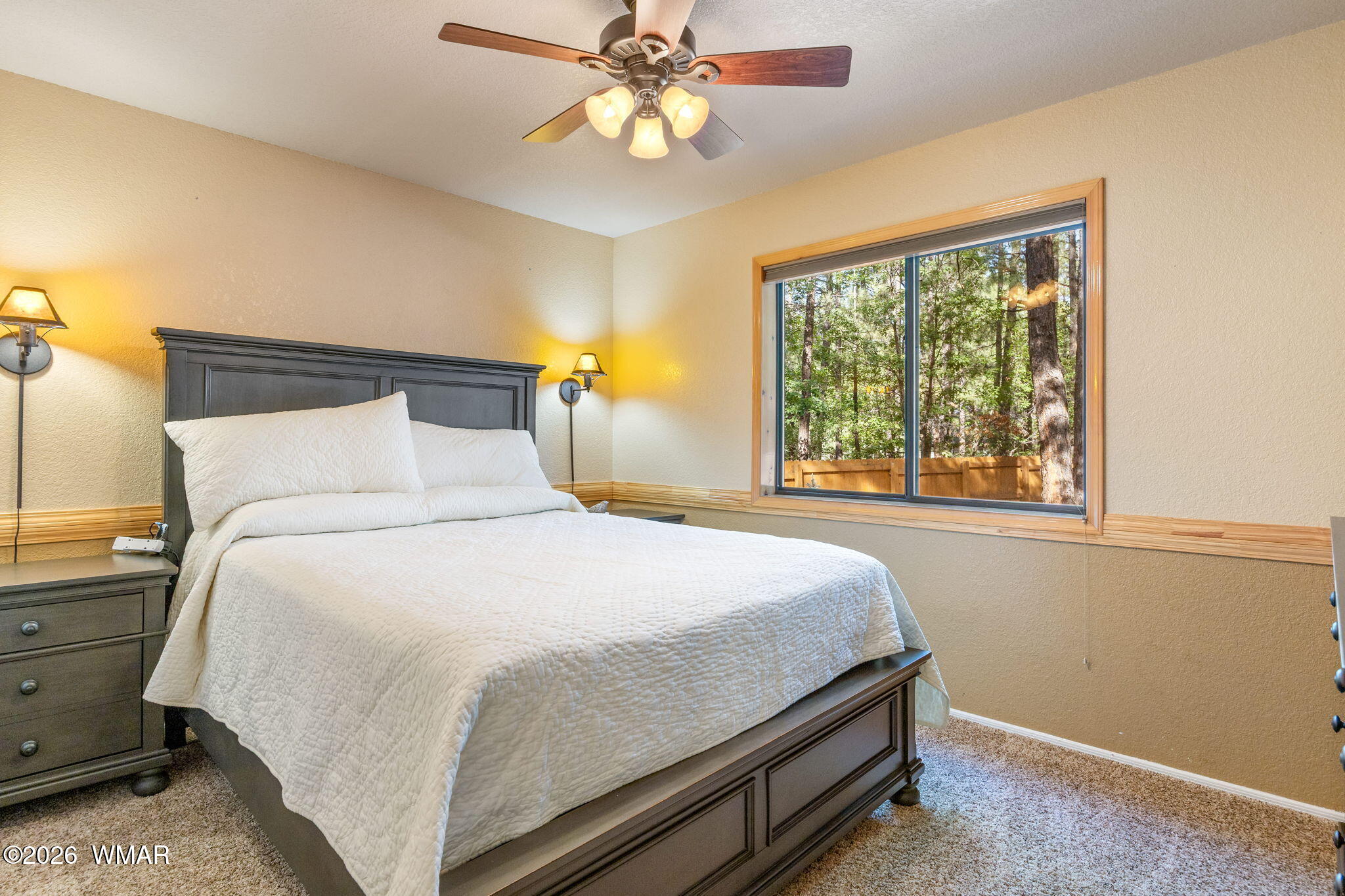 6735 Sunset Trail Pinetop, AZ 85935 - Photo 17 of 33 a bed sitting in a bedroom next to a window