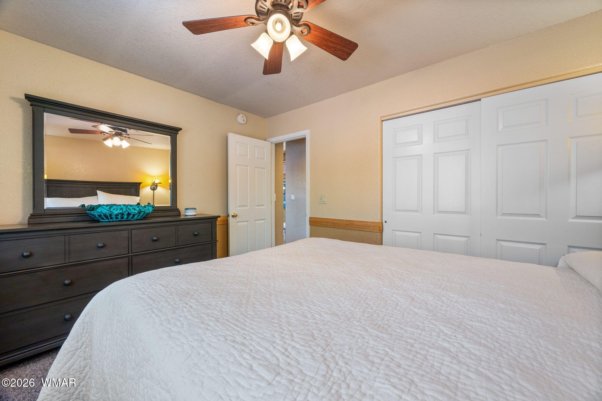 6735 Sunset Trail Pinetop, AZ 85935 - Photo 18 of 33 a bedroom with a large bed and a large window with outer view