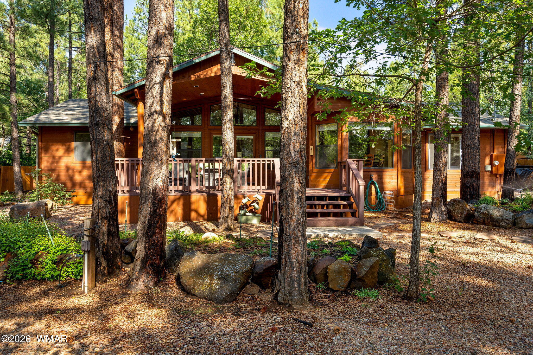 6735 Sunset Trail Pinetop, AZ 85935 - Photo 26 of 33 a view of a street with potted plants and large trees