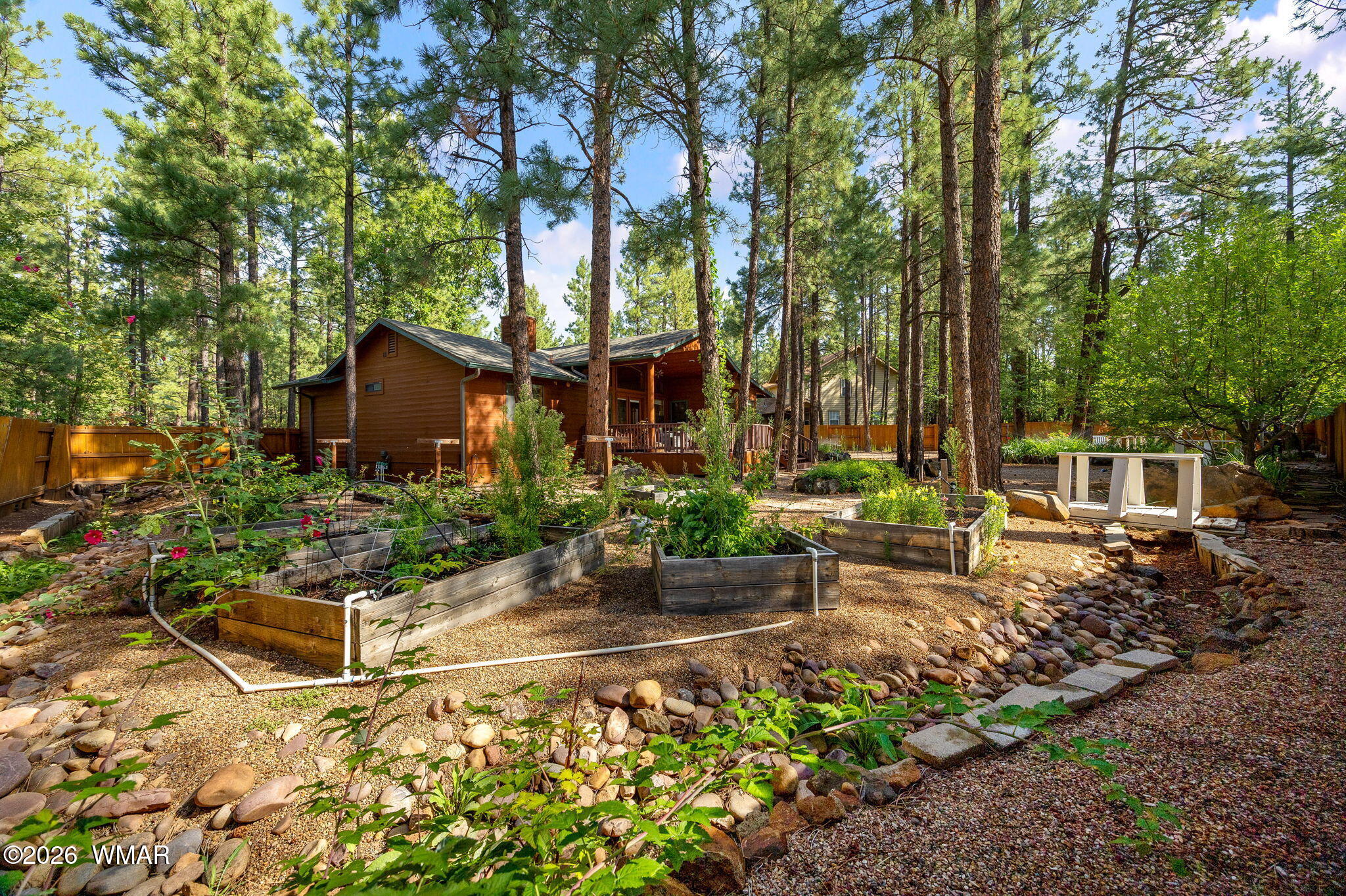 6735 Sunset Trail Pinetop, AZ 85935 - Photo 27 of 33 a view of a house with a garden