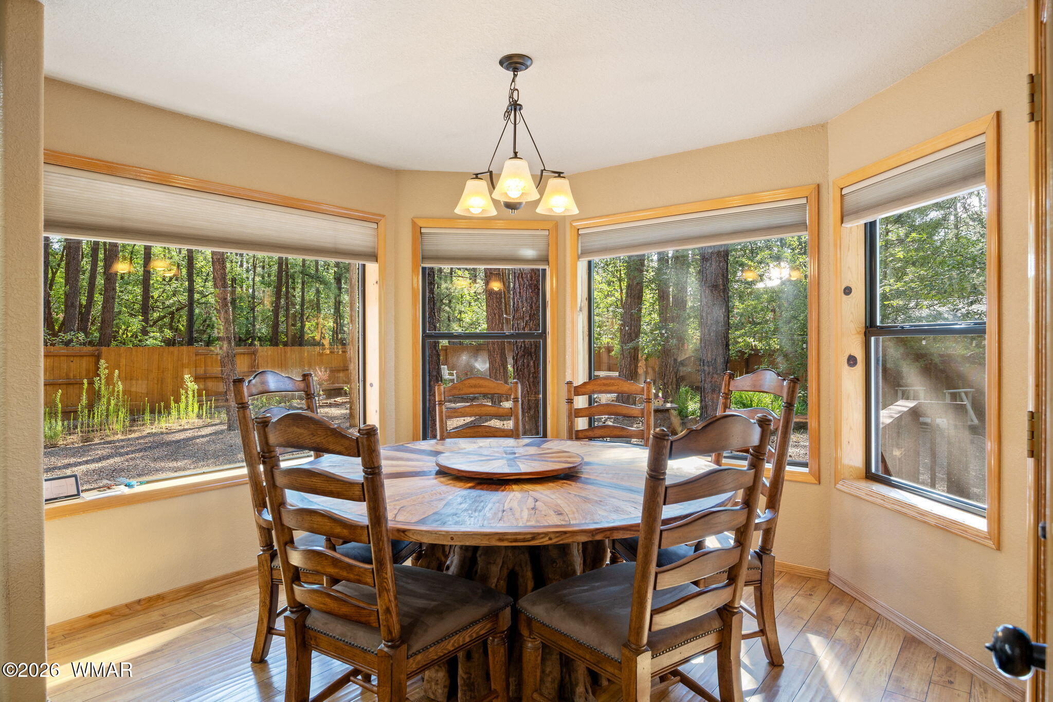 6735 Sunset Trail Pinetop, AZ 85935 - Photo 9 of 33 a dining room with furniture window and wooden floor