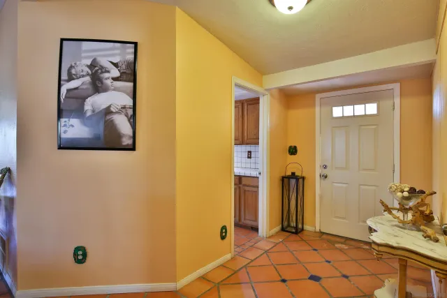 a view of a hallway with bathroom