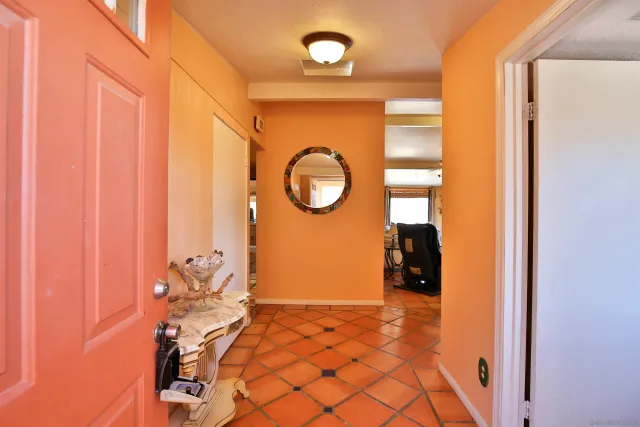a view of an entryway with wooden floor