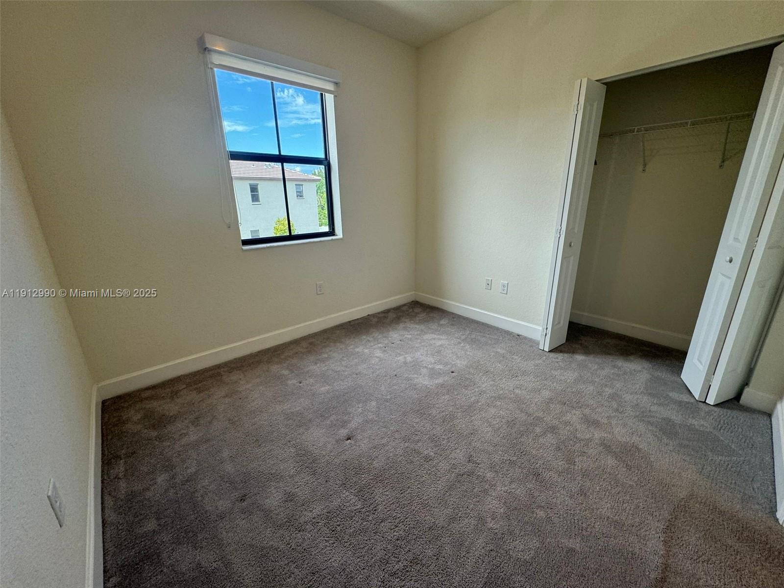 11325 West 34th Way Hialeah, FL 33018 - Photo 14 of 46 an empty room with windows