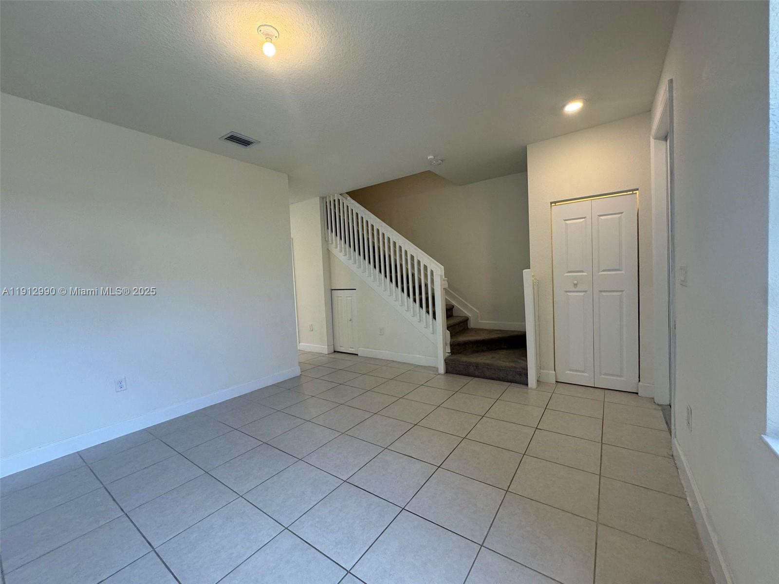 11325 West 34th Way Hialeah, FL 33018 - Photo 22 of 46 an empty room with white walls and entryway