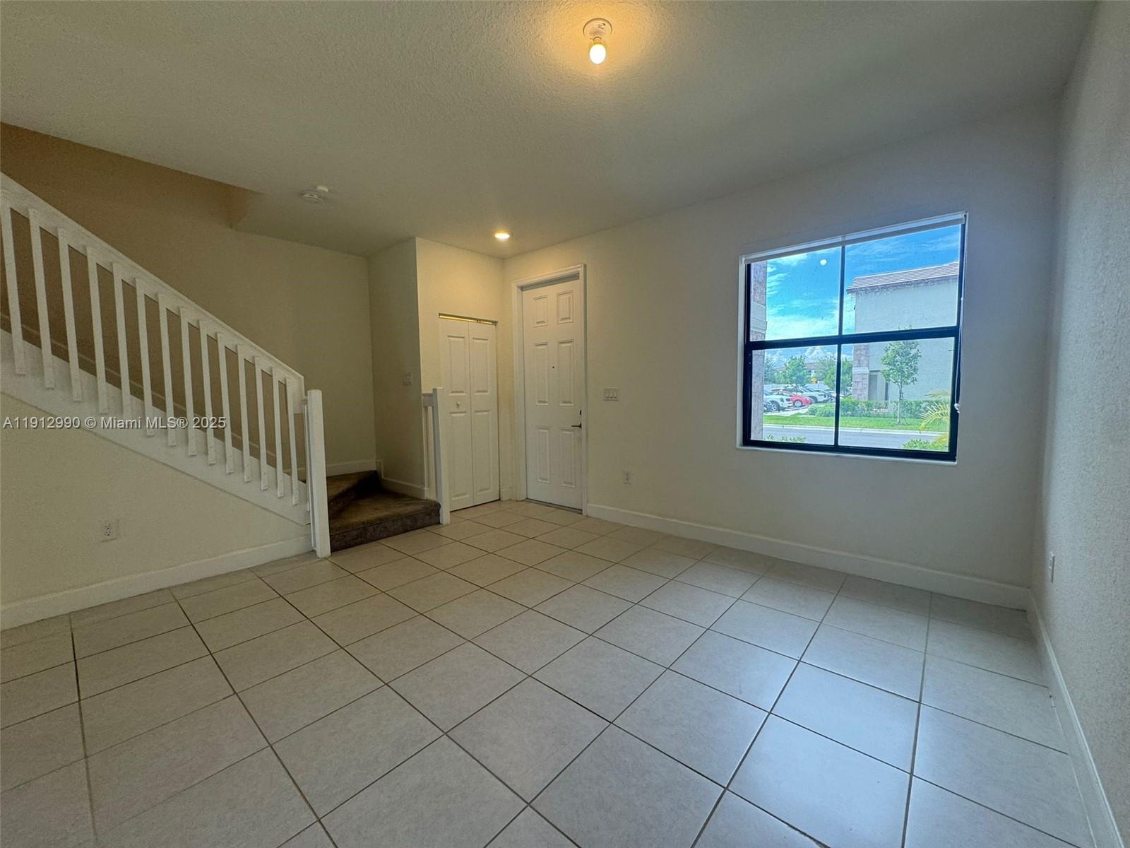 11325 West 34th Way Hialeah, FL 33018 - Photo 23 of 46 an empty room with windows