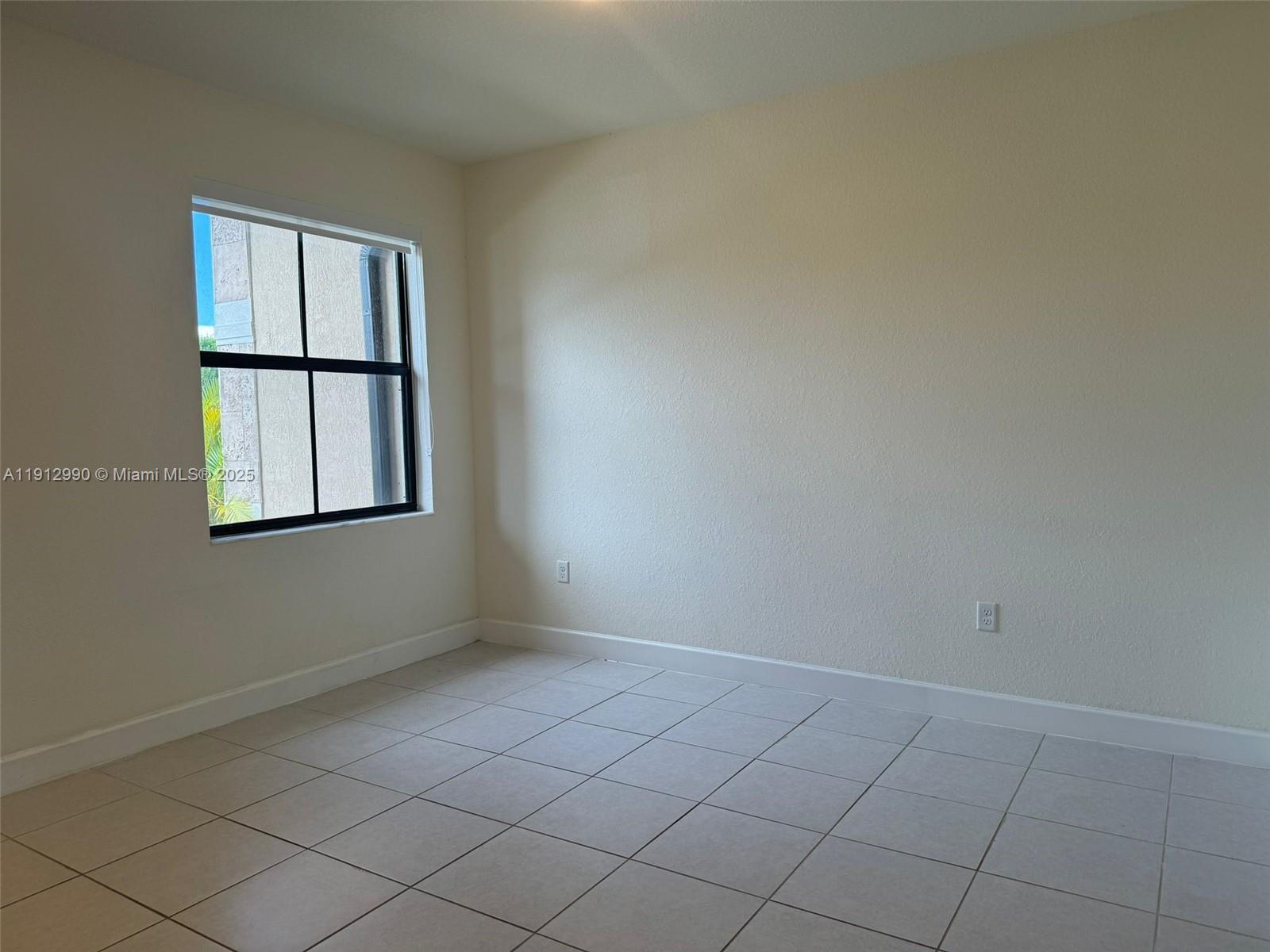 11325 West 34th Way Hialeah, FL 33018 - Photo 24 of 46 an empty room with a window