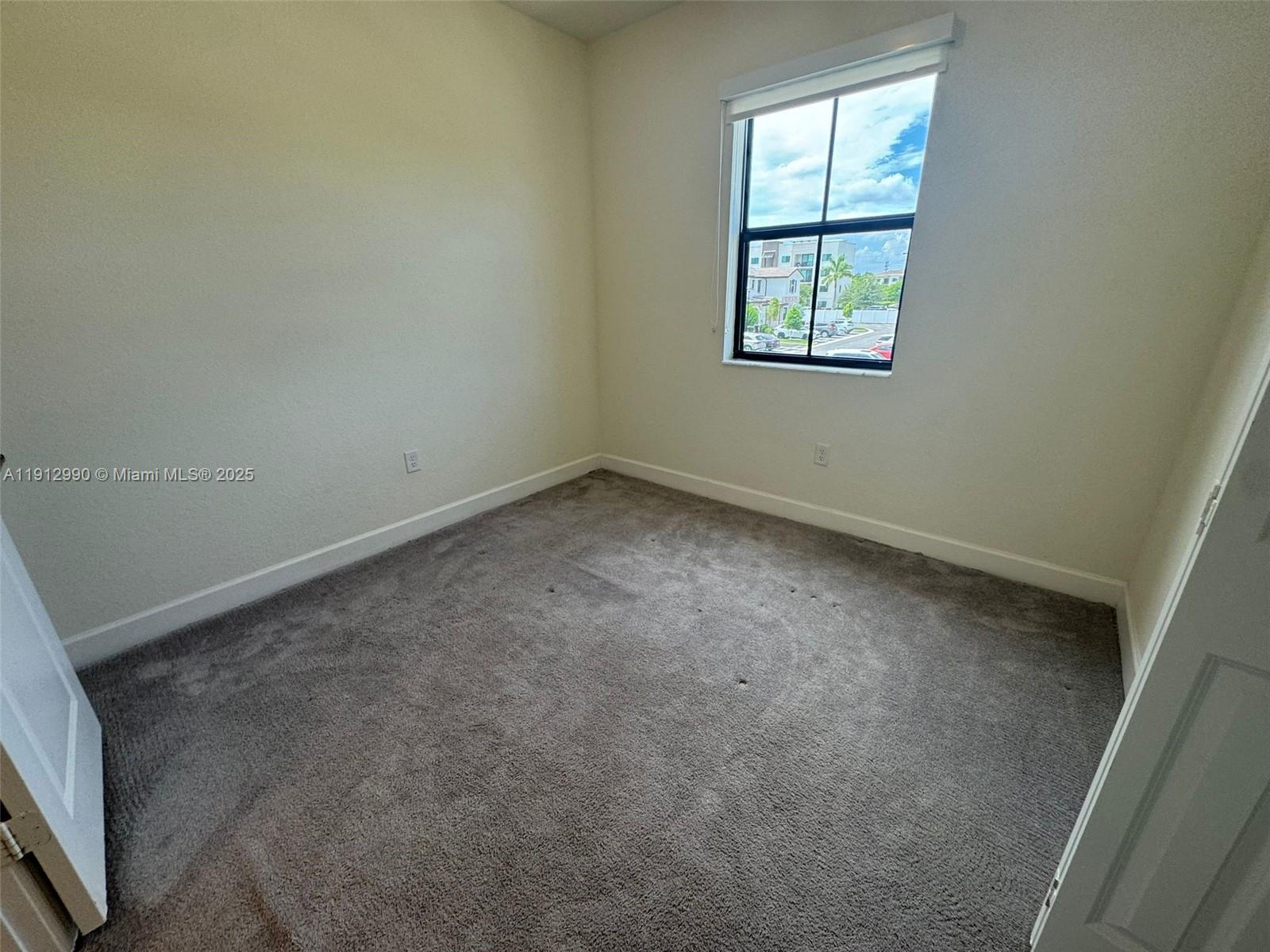 11325 West 34th Way Hialeah, FL 33018 - Photo 29 of 46 an empty room with a window