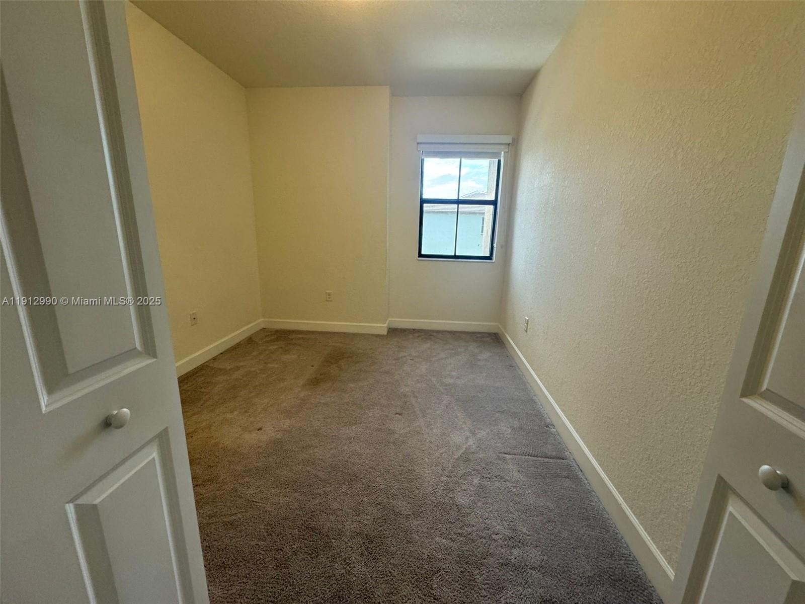 11325 West 34th Way Hialeah, FL 33018 - Photo 30 of 46 an empty room with windows