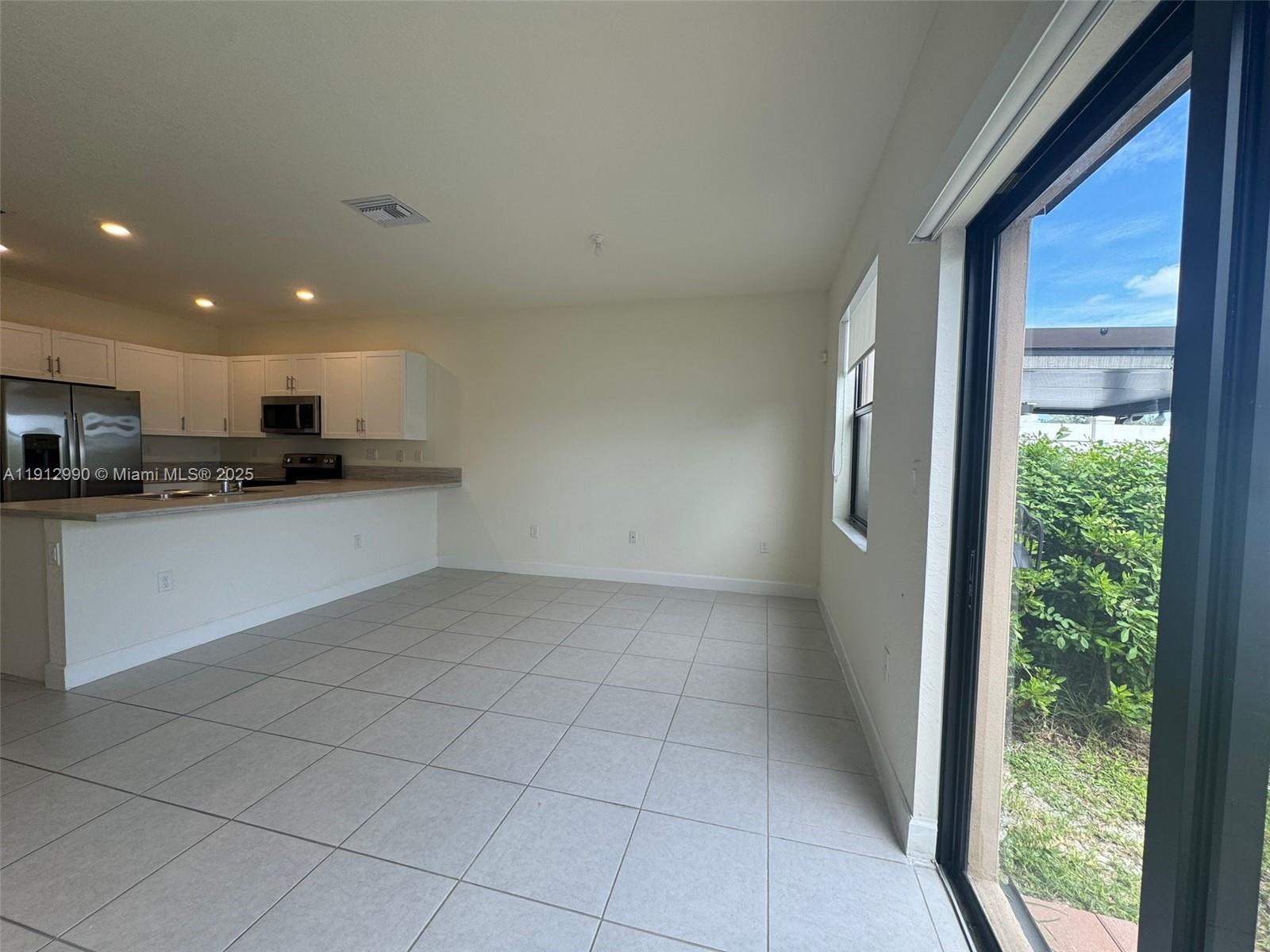 11325 West 34th Way Hialeah, FL 33018 - Photo 3 of 46 a view of a kitchen with a sink and cabinets