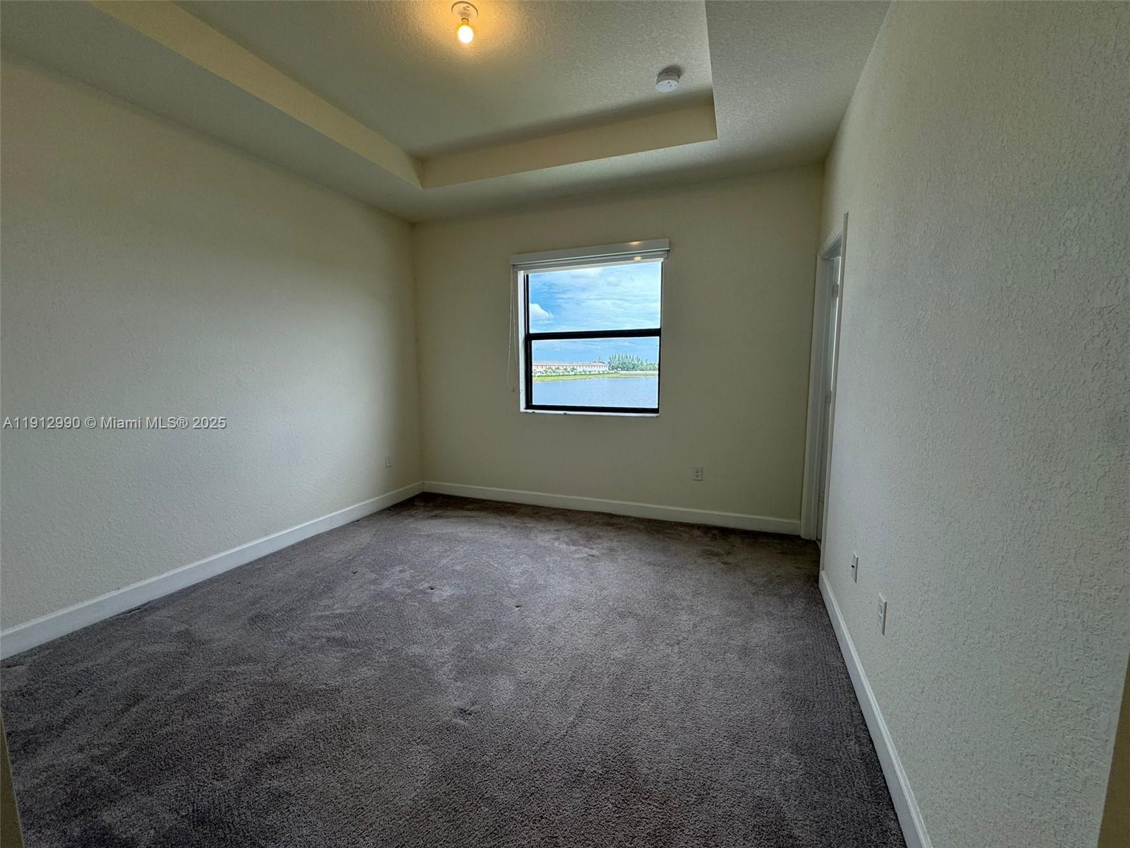 11325 West 34th Way Hialeah, FL 33018 - Photo 32 of 46 an empty room with a window