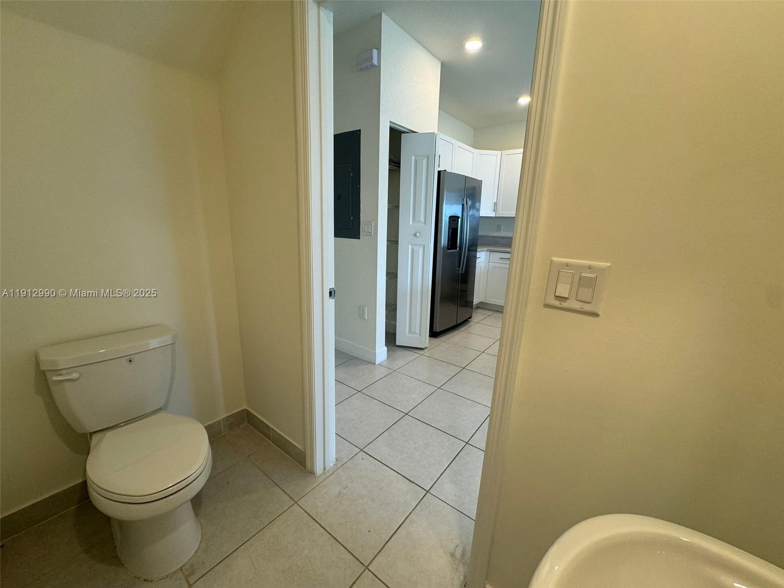 11325 West 34th Way Hialeah, FL 33018 - Photo 37 of 46 a bathroom with a toilet and a shower