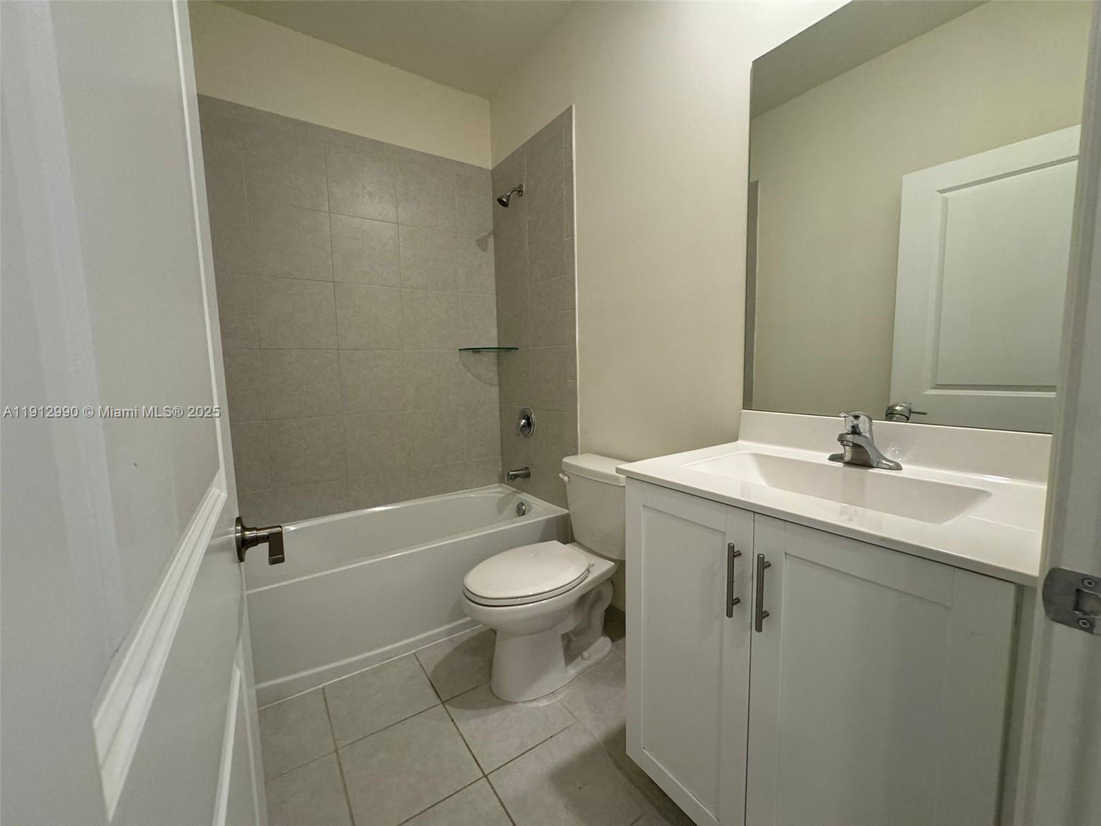 11325 West 34th Way Hialeah, FL 33018 - Photo 38 of 46 a bathroom with a sink toilet and shower