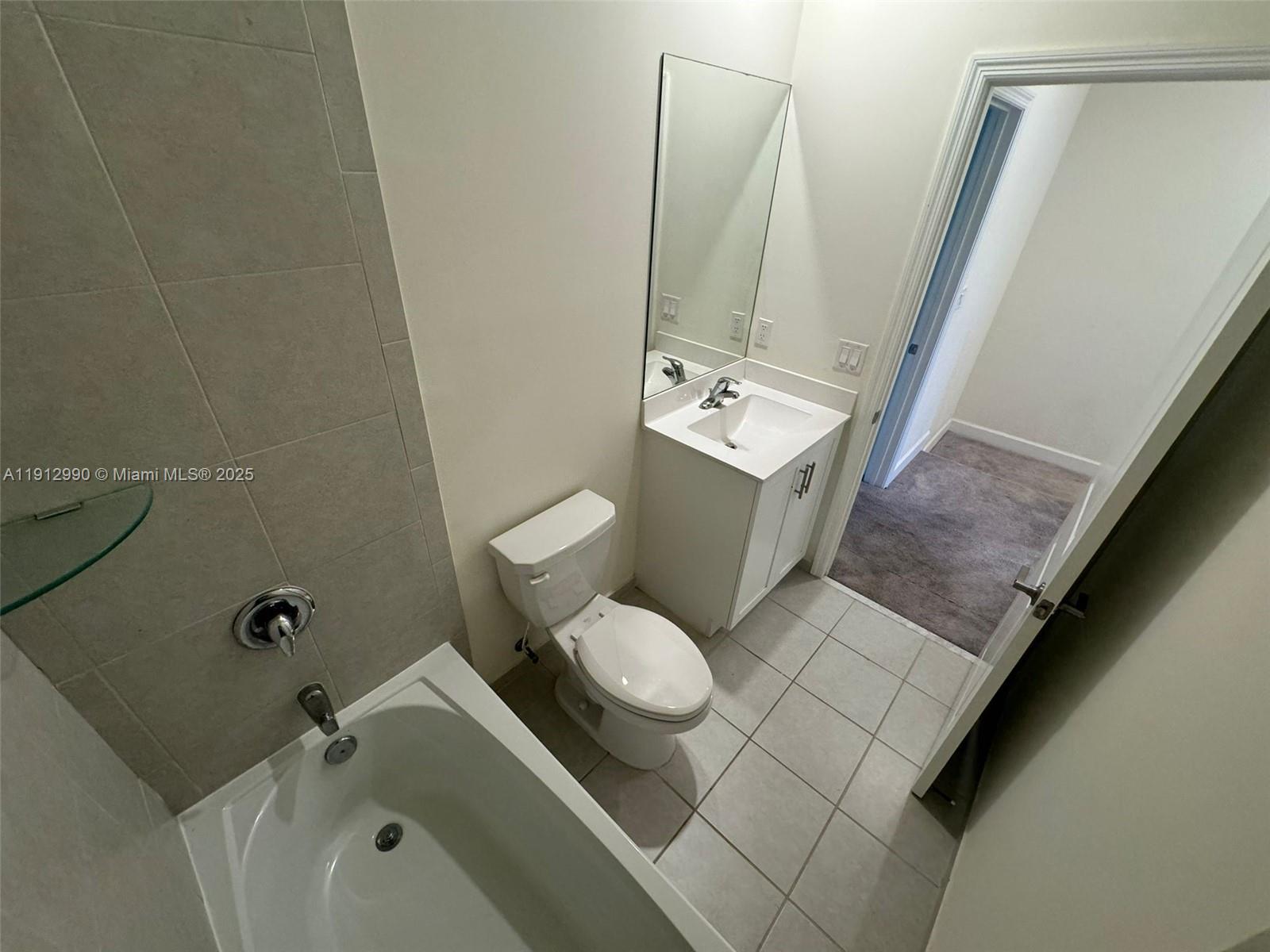 11325 West 34th Way Hialeah, FL 33018 - Photo 39 of 46 a bathroom with a sink toilet and shower