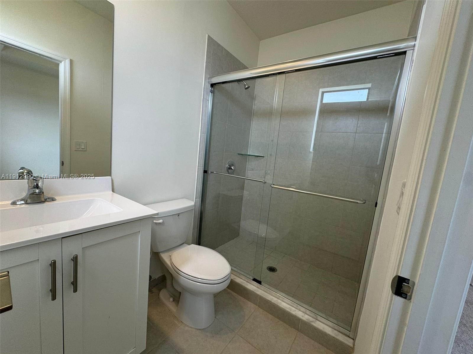 11325 West 34th Way Hialeah, FL 33018 - Photo 41 of 46 a bathroom with a shower sink vanity and toilet