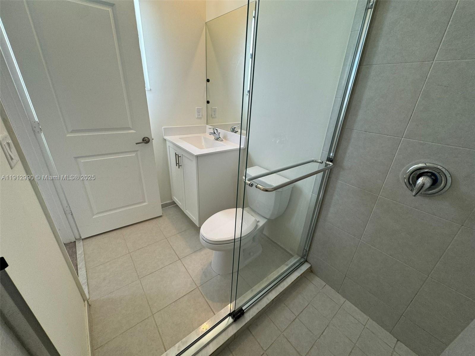 11325 West 34th Way Hialeah, FL 33018 - Photo 42 of 46 a bathroom with a sink and mirror