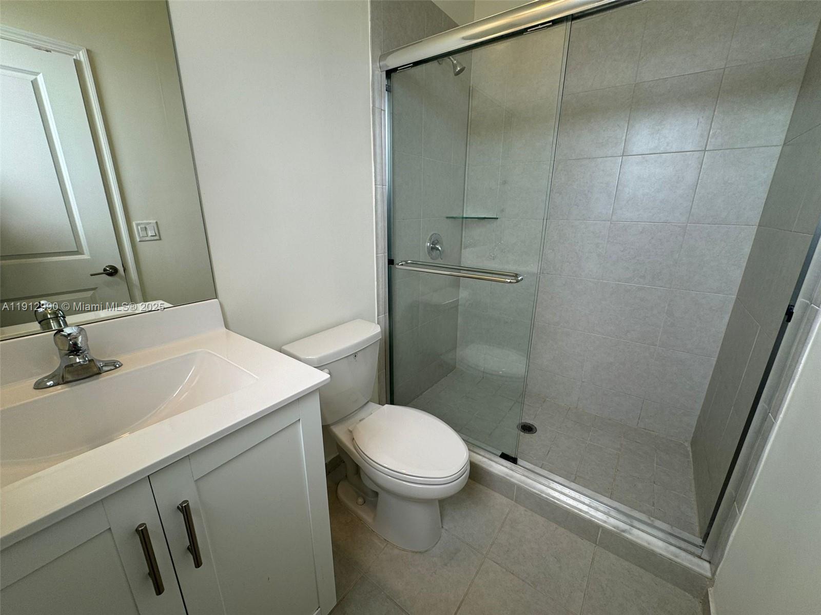 11325 West 34th Way Hialeah, FL 33018 - Photo 44 of 46 a bathroom with a sink a toilet and shower